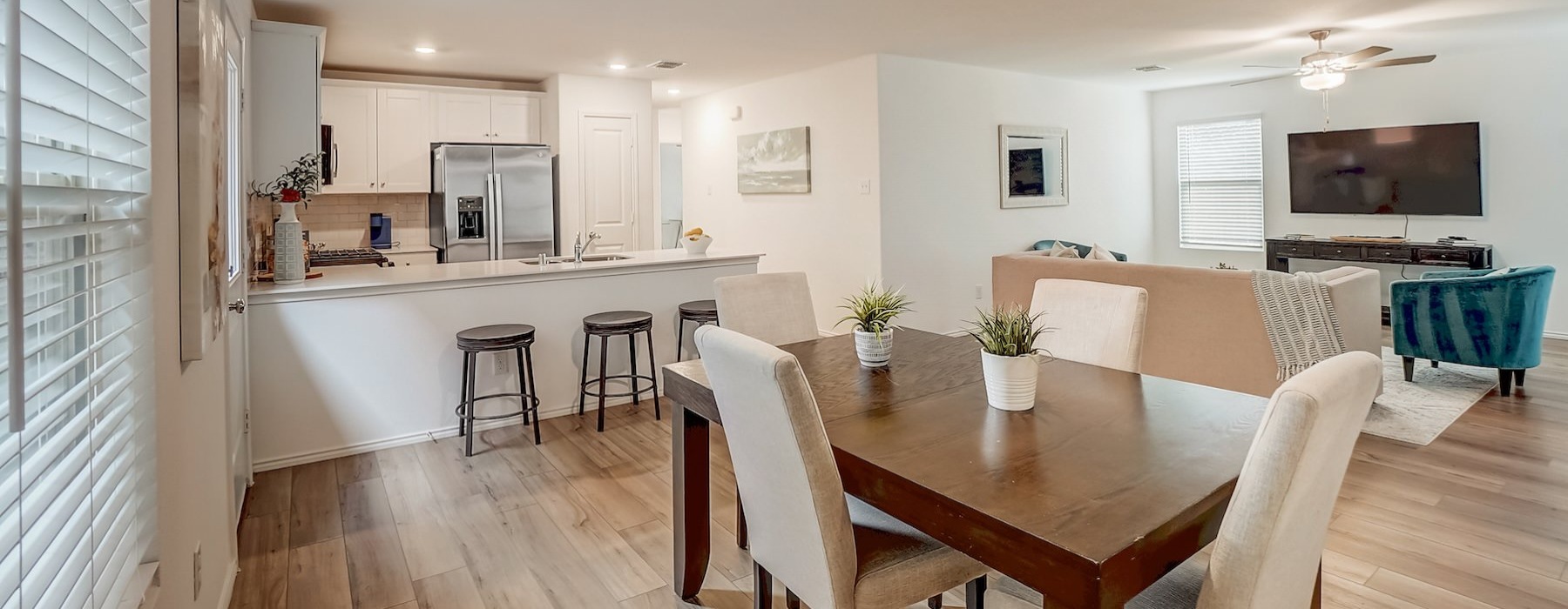a large kitchen with a dining table