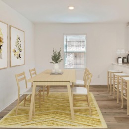 a kitchen with a dining table and chairs